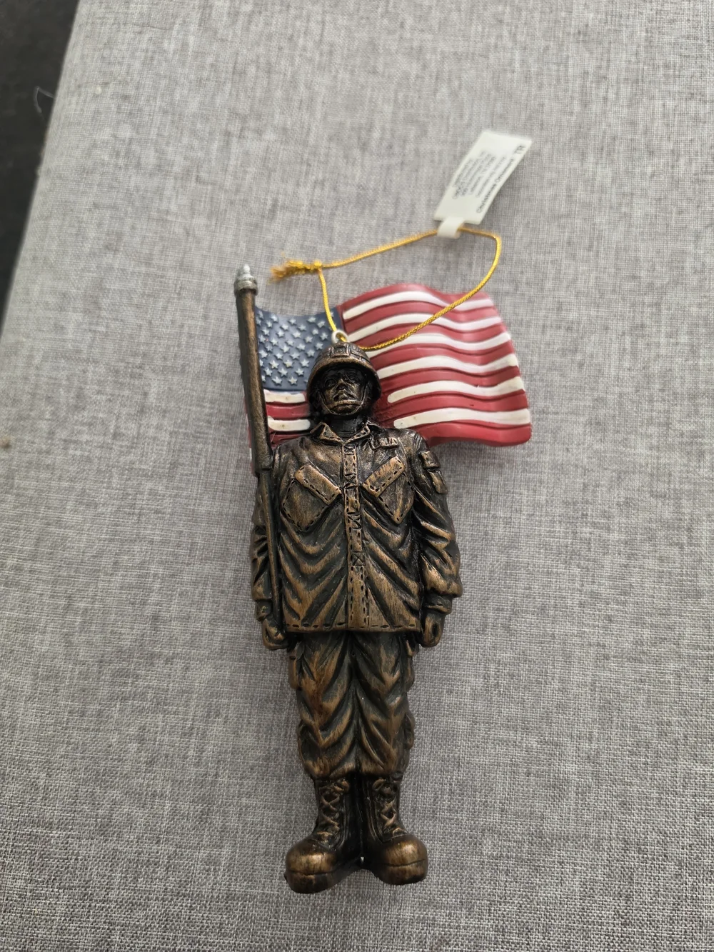 Cracker Barrel Bronze Soldier Ornament with Red, White & Blue Flag